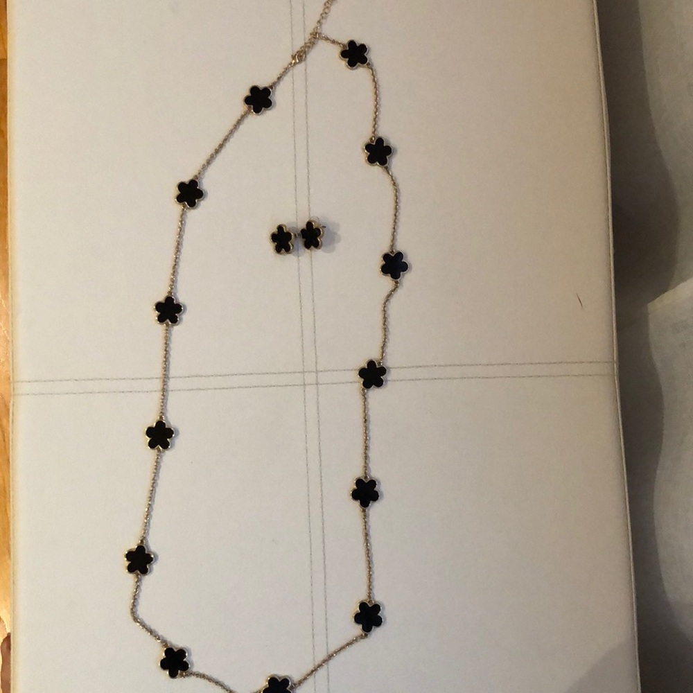 Gold tone and black necklace and earrings